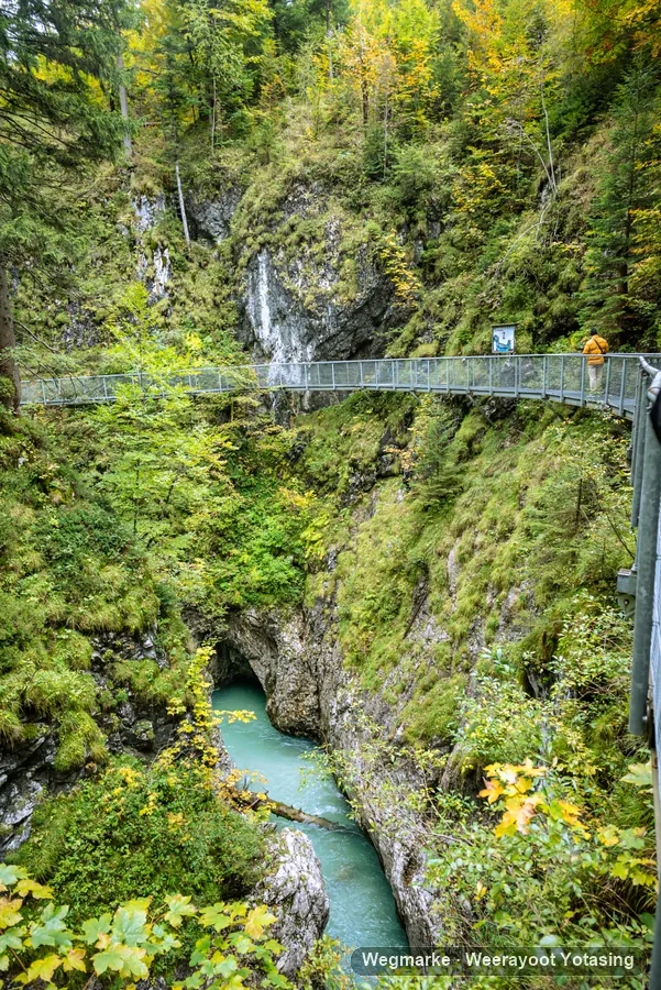 Hikers crossing a suspension bridge