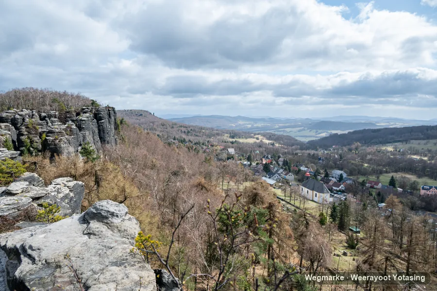 A traveler in a wide stone landscape